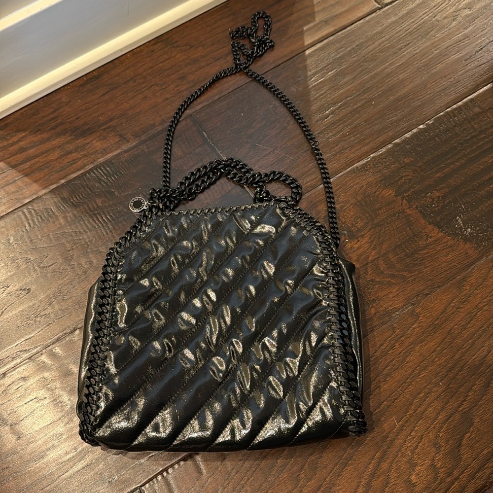 Used once. Stella McCartney black out Falabella bag with crossbody strap. Patent